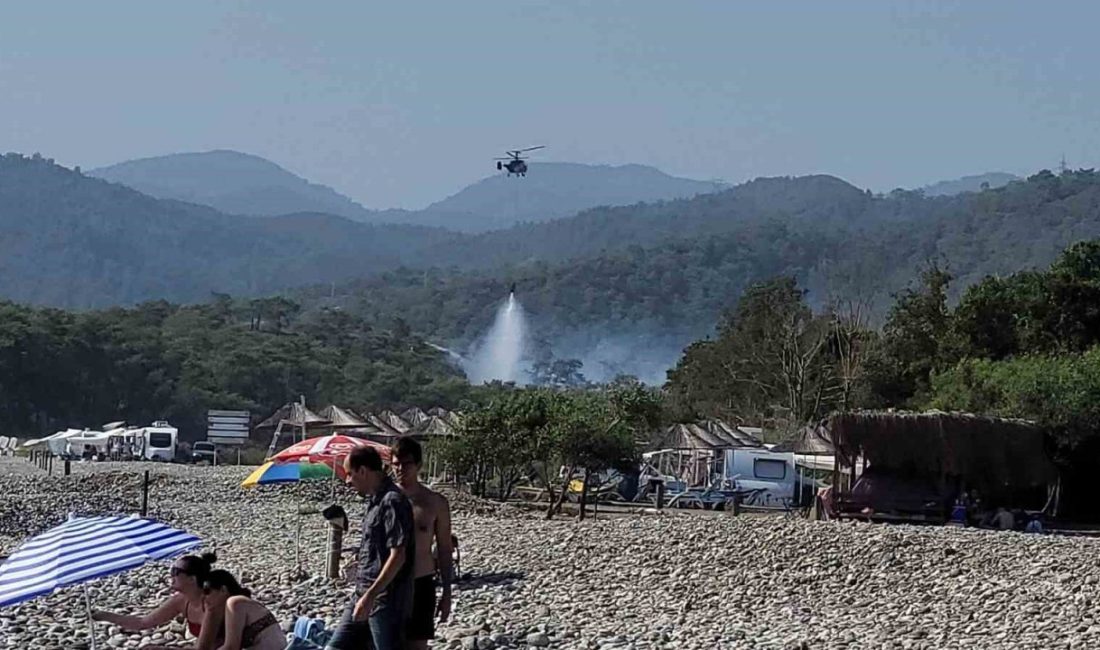 Muğla’nın Fethiye ilçesi Katrancı koyunda başlayan orman yangını ekiplerin havadan
